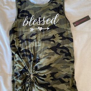 This shirt is an army green Camo color/design. Size xs